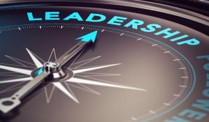 A compass pointing toward the word leadership